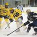 Michigan senior center A.J. Treais moves the puck up the ice in the game against Notre Dame on Friday. Daniel Brenner I AnnArbor.com
